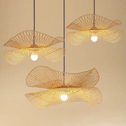Three elegant golden-brown woven bamboo chandelier pendant lights with fan design by decorbites for kitchen decor