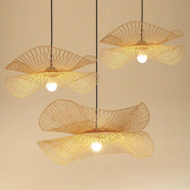 Three elegant golden-brown woven bamboo chandelier pendant lights with fan design by decorbites for kitchen decor