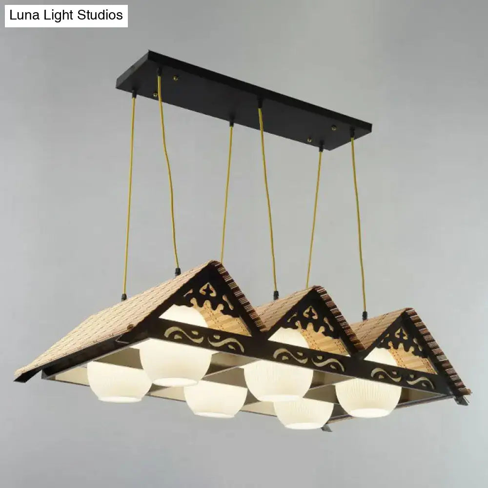 Decorbites bamboo pendant light in black and beige with woven roof design and decorative cutouts for triangle roof restaurant