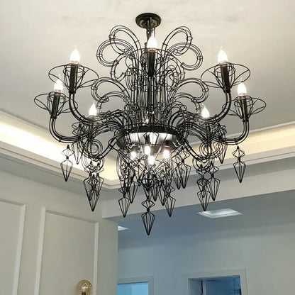 Black wrought iron decorbites baroque black chandelier with intricate swirling arms and geometric crystal pendants