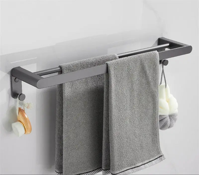 Modern matte black double towel rack with two gray textured towels from decorbites bathroom hardware set