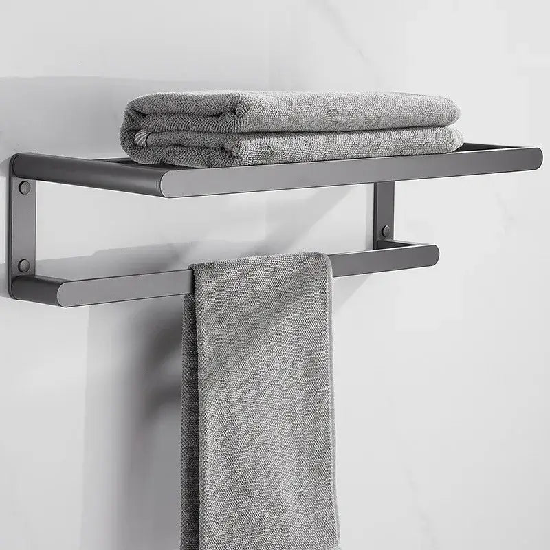 Modern matte black metal towel rack with sleek minimalist design holding gray towels from decorbites bathroom hardware set