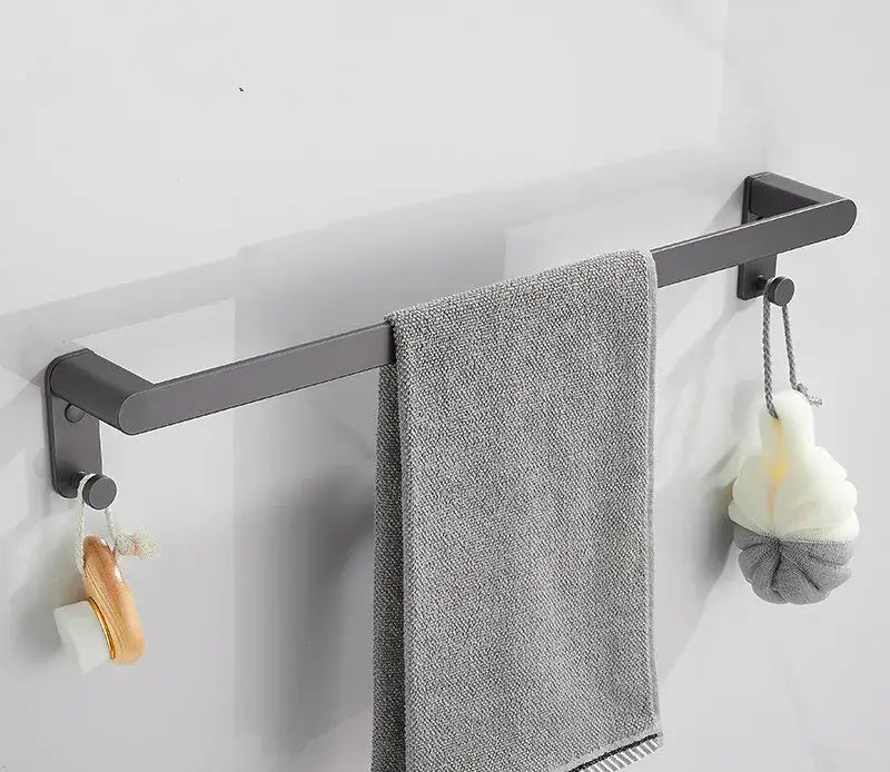 Gray metal towel rack with sleek modern design holding textured gray towel from decorbites bathroom hardware set