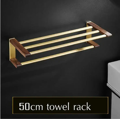 Gold-finished metal towel rack with dark wood end caps and three bars from decorbites bathroom hardware set in space aluminum