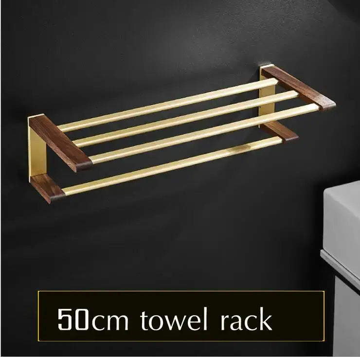 Gold-finished metal towel rack with dark wood end caps and three bars from decorbites bathroom hardware set in space aluminum