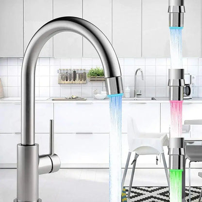 Modern stainless steel decorbites™ led faucet aerator with sleek curved spout and blue illuminated water flow