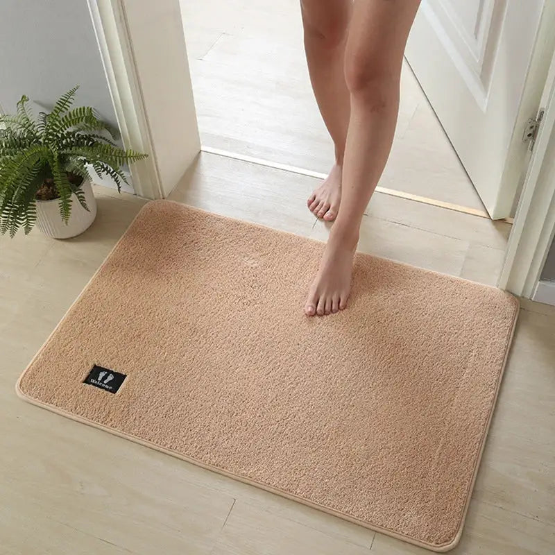 Beige rectangular bathroom mat from decorbites bathroom mat collection with soft plush texture and subtle border design