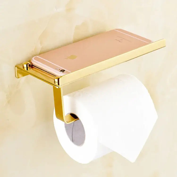 Gold-toned metal paper phone holder with integrated phone rack holding rose gold iPhone for decorbites bathroom paper use