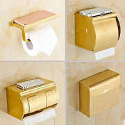Gold-colored metallic DecorBites bathroom paper phone holder with sleek modern design and flat top for smartphone