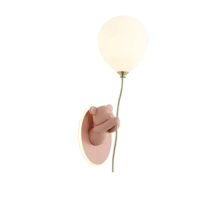 Pastel pink decorbites bear artistic wall lamp with frosted glass globe on gold-toned stem for kids room decor
