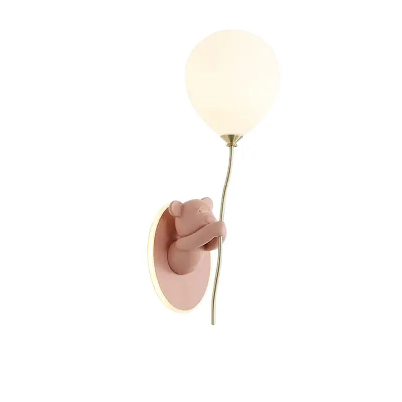 Pastel pink decorbites bear artistic wall lamp with frosted glass globe on gold-toned stem for kids room decor