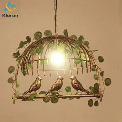Antique brass Decorbites birdcage led chandelier with green vines and three detailed birds for black and white bedroom light