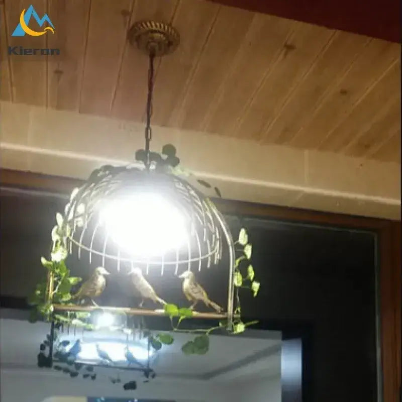 Decorbites birdcage led chandelier black and white bedroom light with brass frame, three birds, and green vines entwined