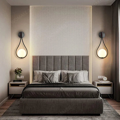 Gray upholstered bed shown alongside decorbites™ black battery operated wall sconces with remote and usb type-c charging