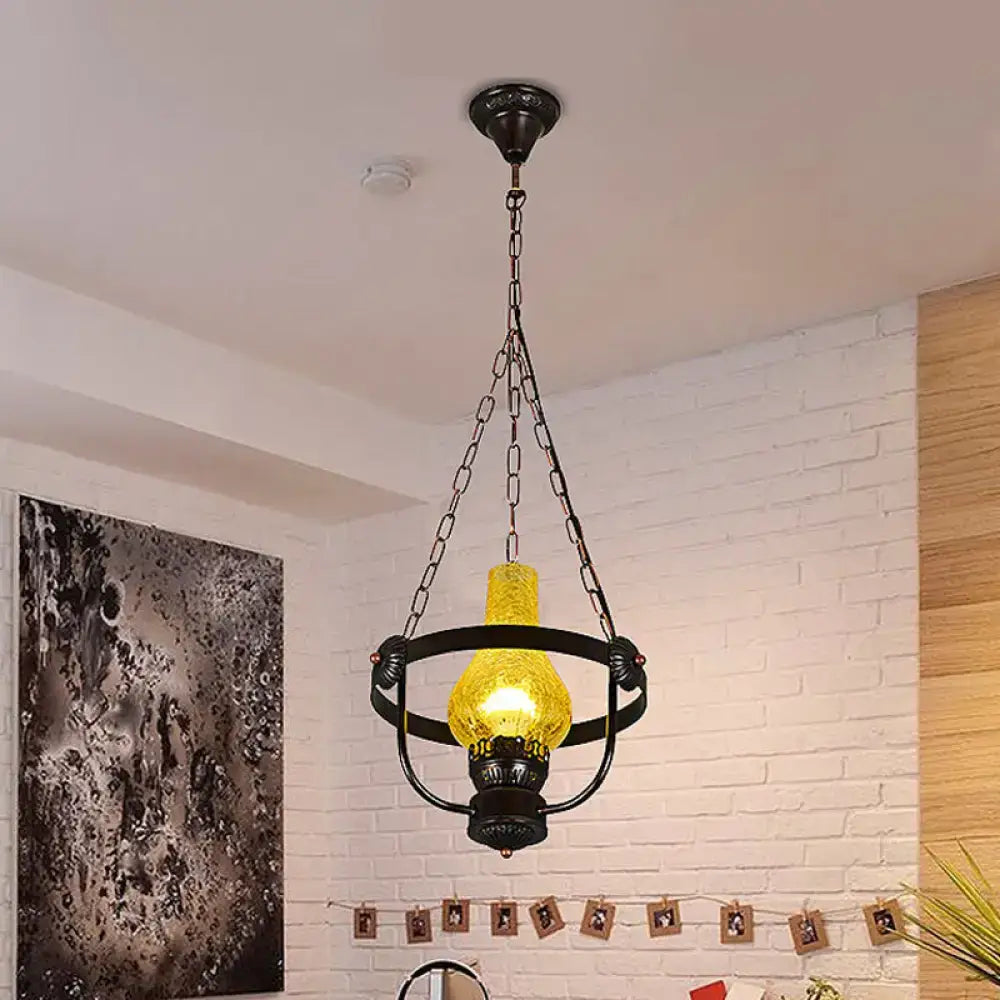 DecorBites black crackle glass pendant light with metal ring and glowing yellow bulb in classic vase shade design
