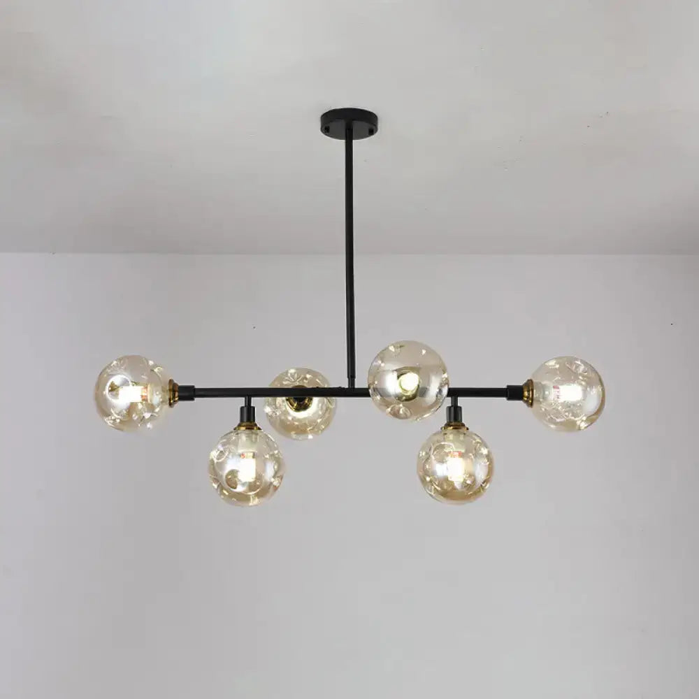 Black metal chandelier with six spherical dimpled glass bulbs light type for modern dining room island by decorbites