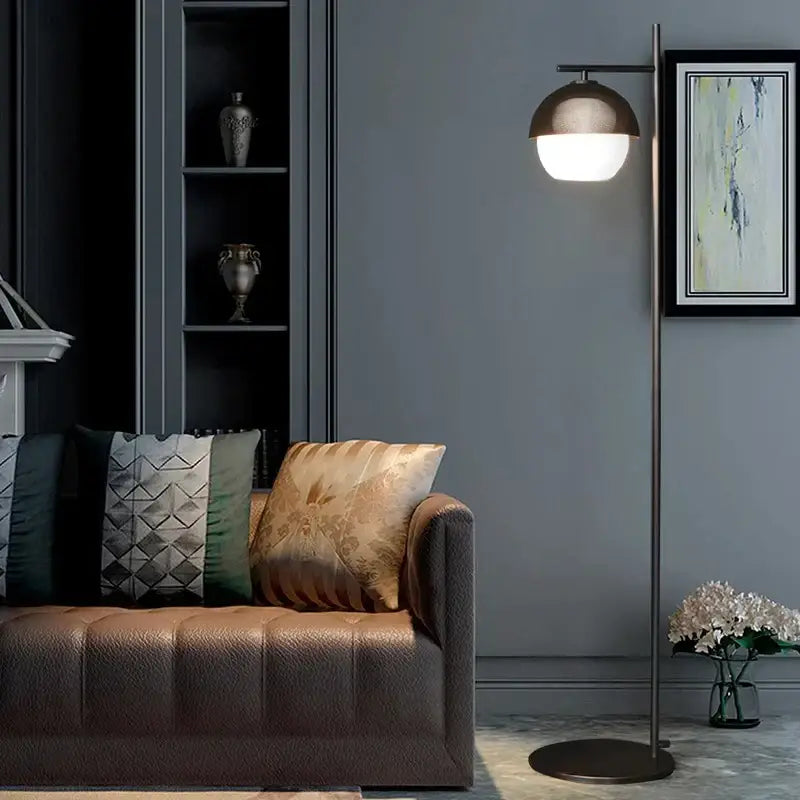 Modern floor lamp with a sleek brushed bronze finish and dome-shaped shade from decorbites black glass ball collection
