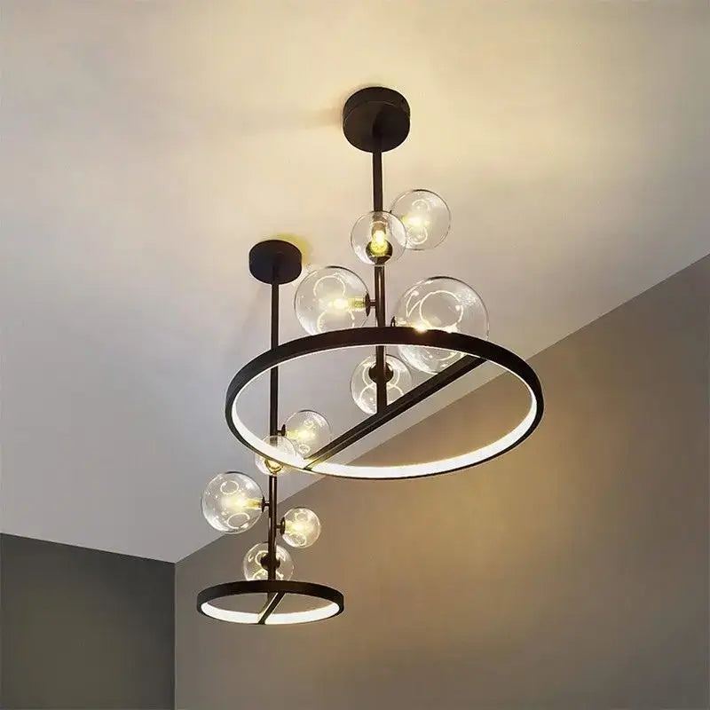 Modern black metal led pendant chandelier with clear glass spheres and circular led rings for dining room and kitchen