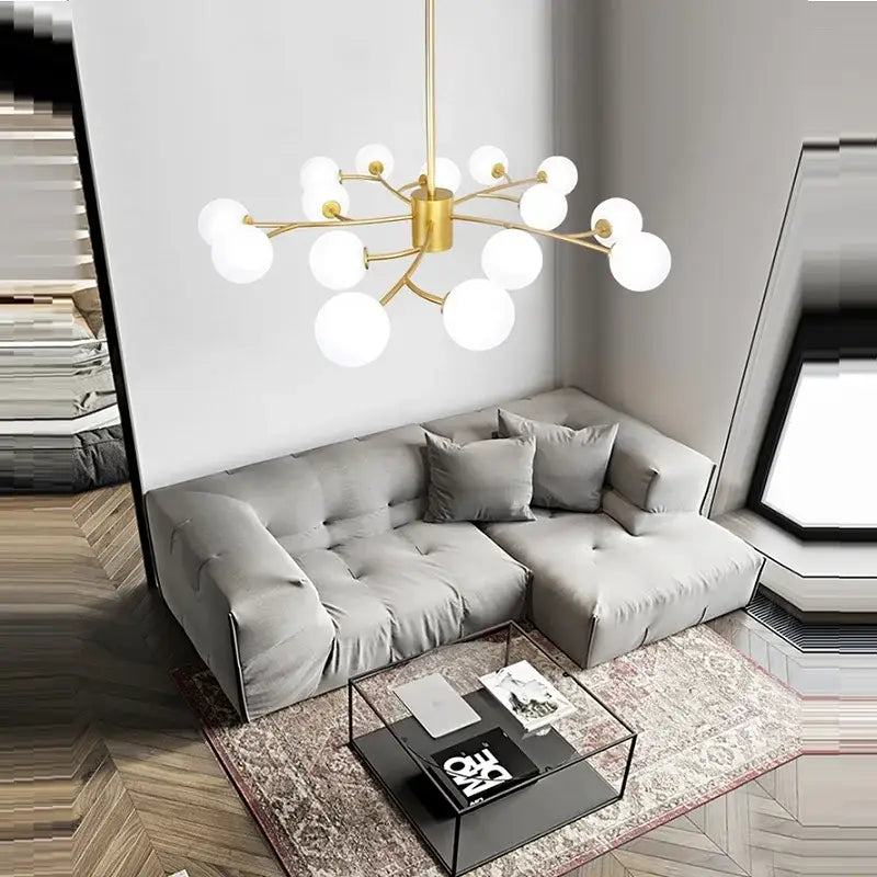 Gold-toned decorbites black glass ball molecule chandelier with multiple spherical white glass bulbs in nordic luxury design