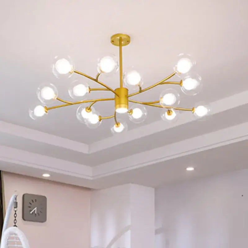 Gold-toned DecorBites black glass ball molecule chandelier with clear glass globe bulbs in nordic luxury design