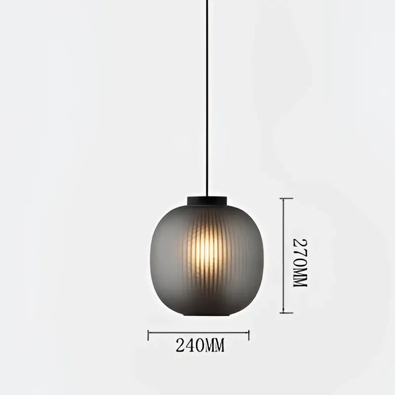 A sleek dark gray ribbed glass decorbites black glass ball table light with black metal fixture for bedroom and living room