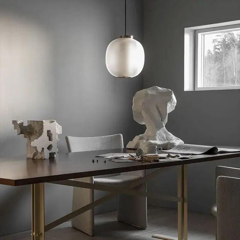Decorbites black glass table light with a white frosted glass ball pendant for bedroom and living room lighting