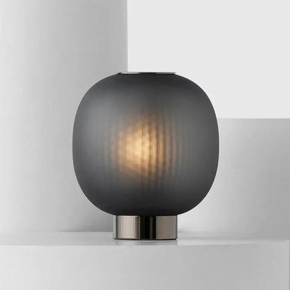DecorBites black glass ball table light with sleek dark gray frosted glass and brushed metal base for bedroom use