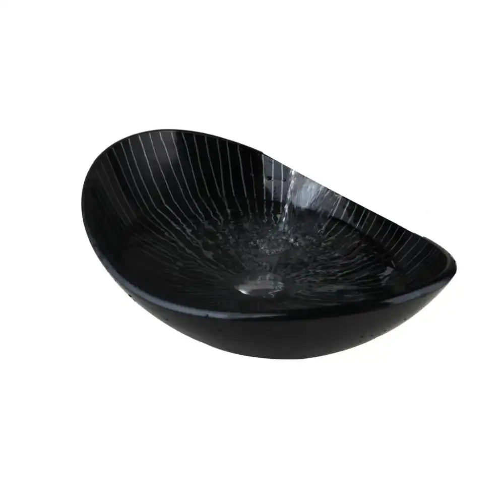 Black ceramic vessel sink with glossy finish and vertical striations in decorbites black glass bathroom sink set