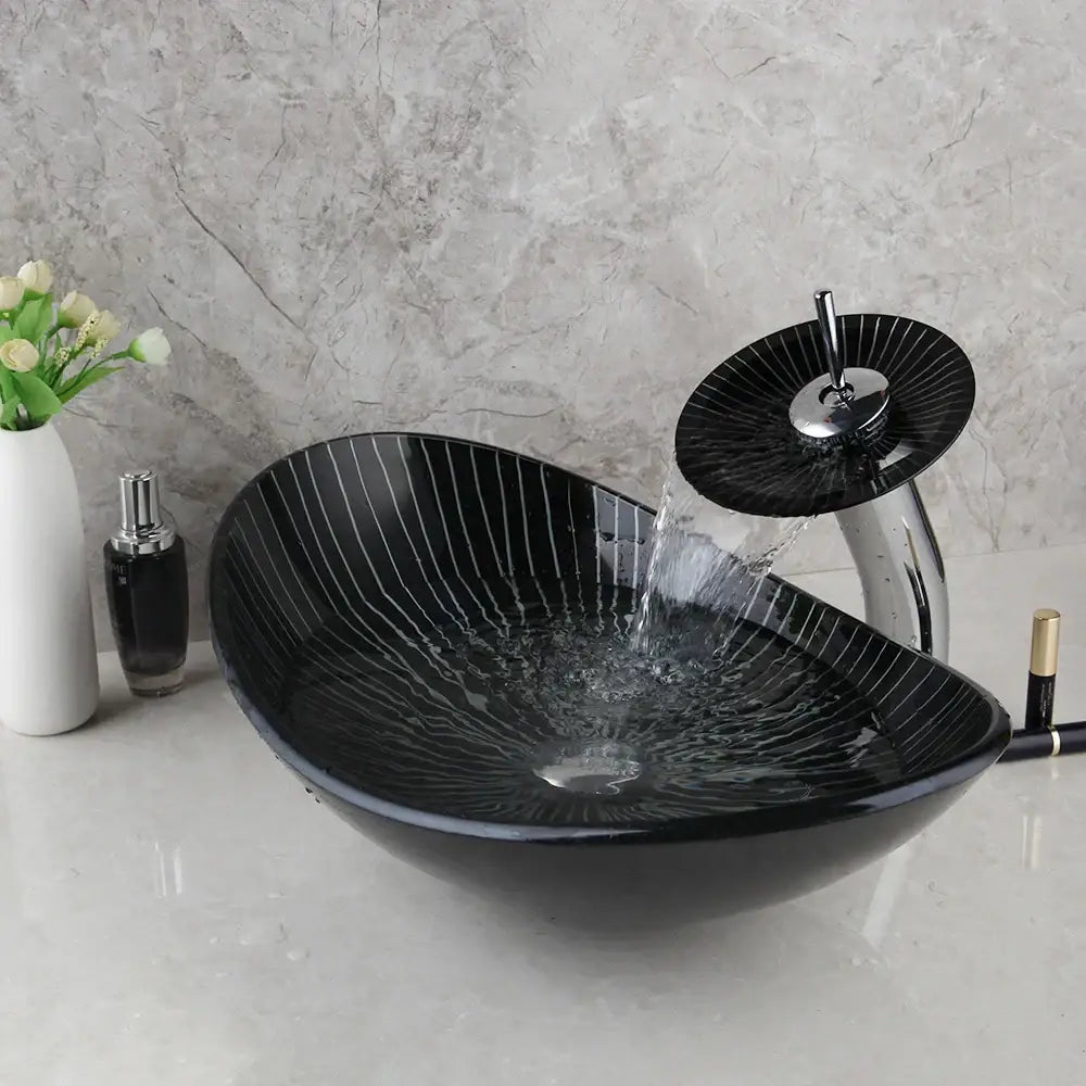 Decorbites black glass bathroom sink set featuring a sleek vessel sink with hand painted white radial stripes and waterfall faucet