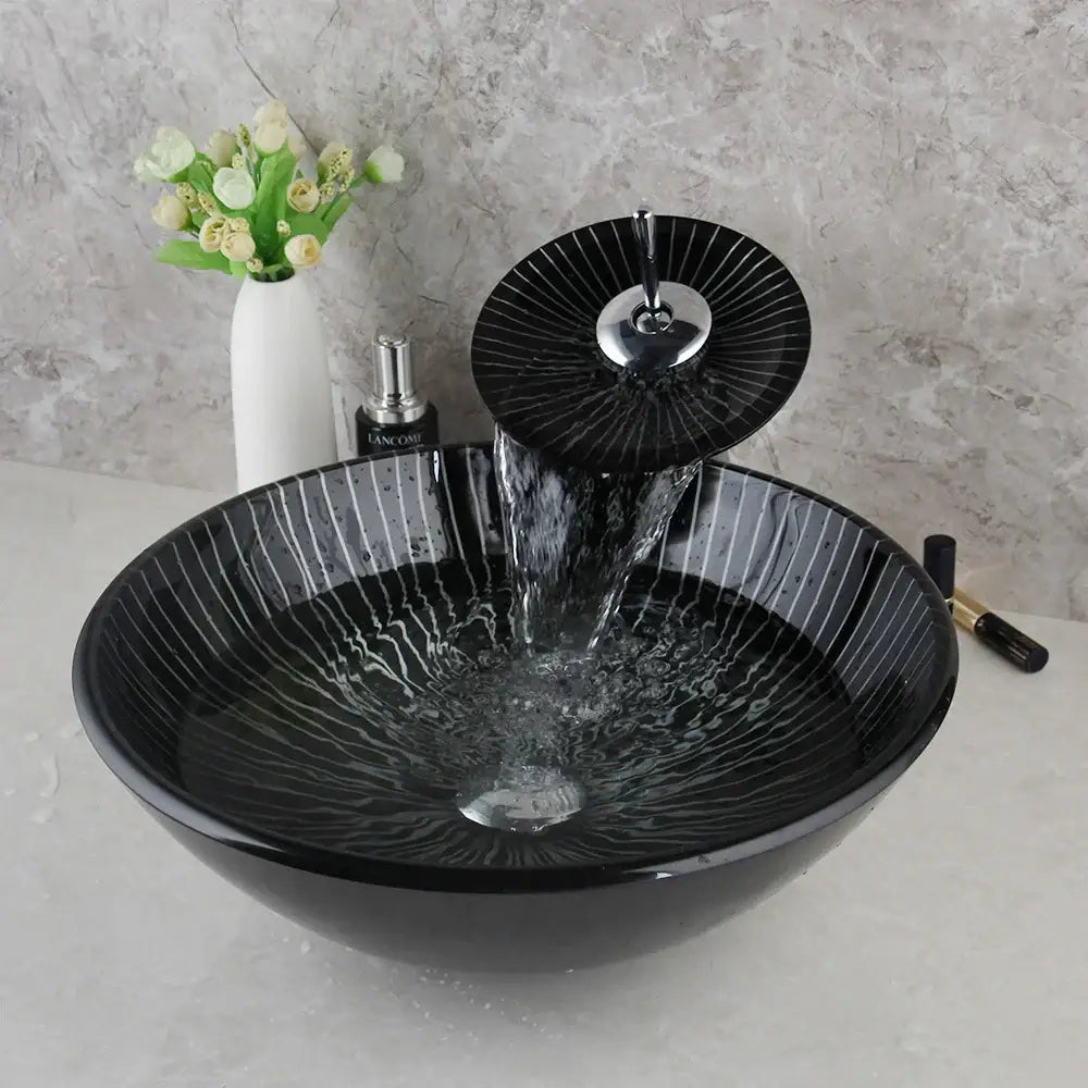 Decorbites black glass bathroom sink set with hand painted radial white streaks and waterfall faucet in sleek design