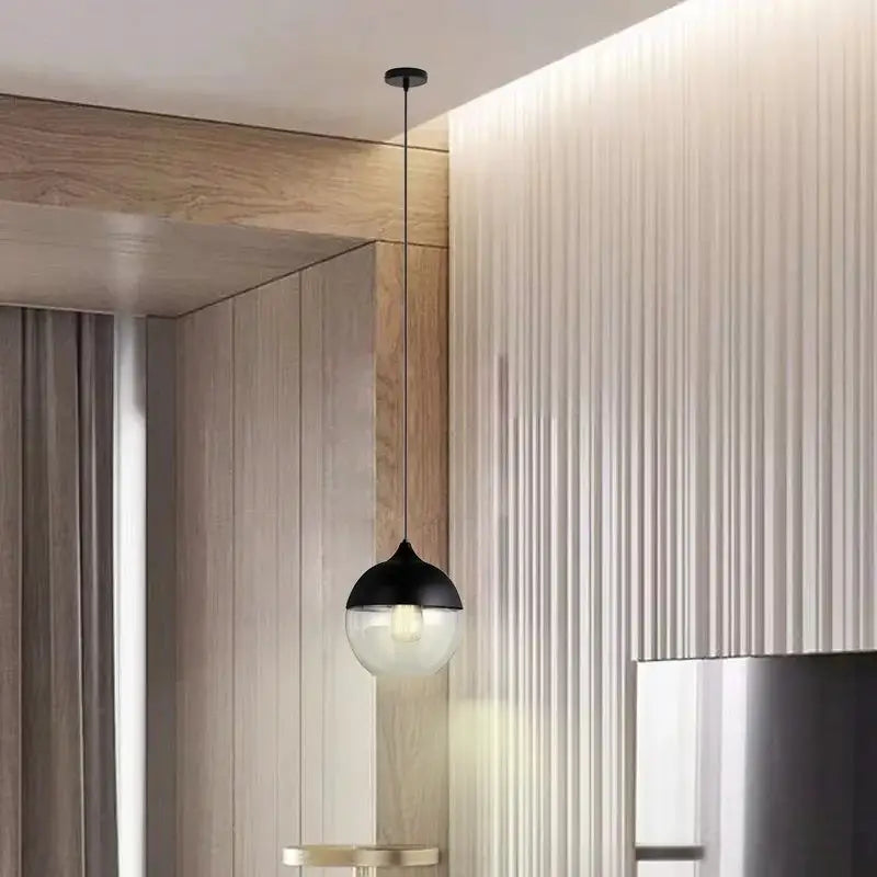 Decorbites black glass pendant lights featuring sleek black and clear glass for modern dining rooms kitchens and bedrooms