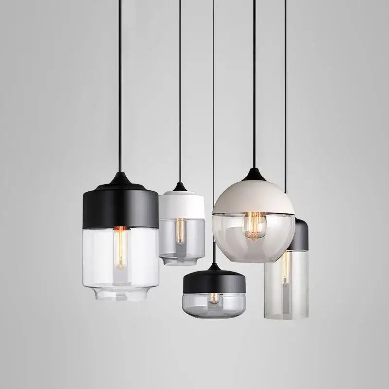 Modern decorbites black glass pendant lights with clear shades and exposed bulbs for dining room and kitchen use