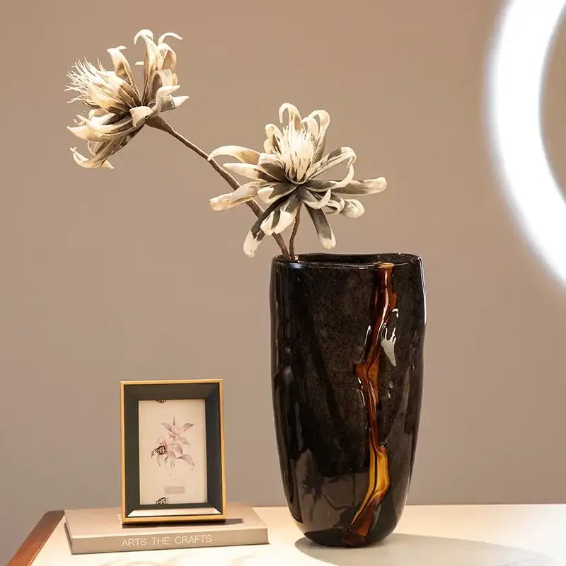 DecorBites black glass vase is a sleek glossy ceramic black glass vase with an amber vertical streak for floral arrangement