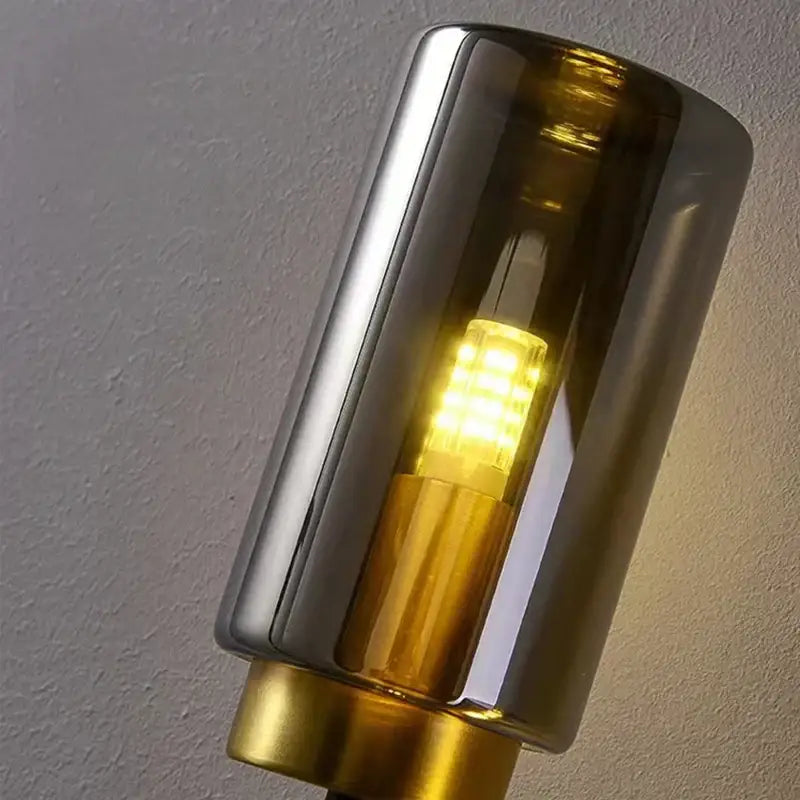Decorbites black glass wall lamp modern cylindrical sconce with smoked glass and brass accents for living room decor