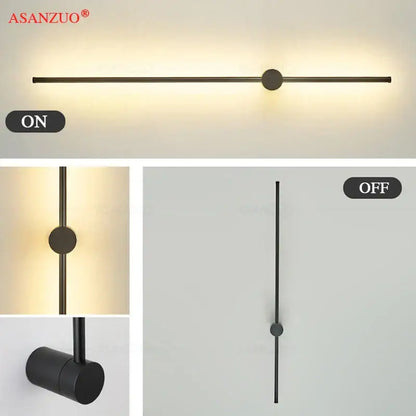 Black metal wall sconce with sleek cylindrical design and central circular accent by DecorBites black gold aluminum