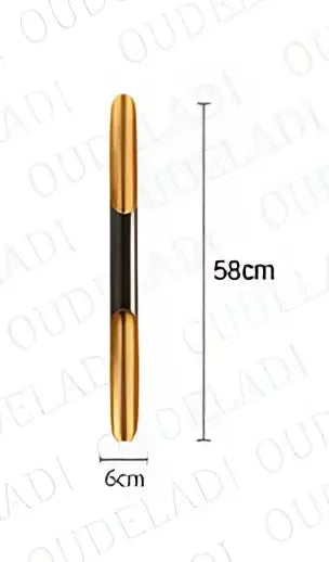 Gold-colored sleek slender pen with black grip section shown alongside decorbites black gold aluminum tube wall sconce