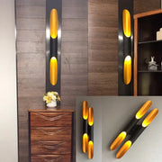 Modern decorbites black gold aluminum tube wall sconce with oval led design for bedroom and living room decor
