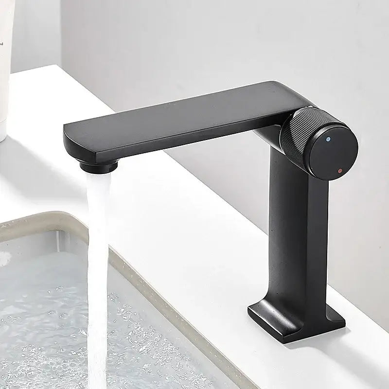 Modern matte black gold basin faucet by decorbites with sleek minimalist design and textured circular handle for bathroom sink