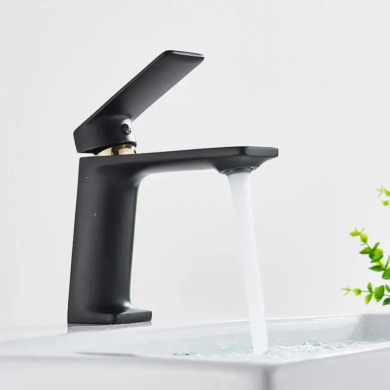 Modern decorbites black gold basin faucet with sleek matte black finish and gold handle for deck mounted bathroom sink