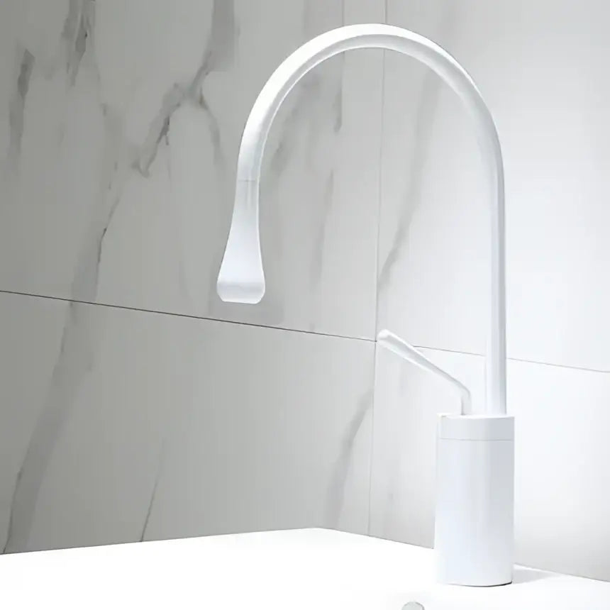 White modern kitchen basin faucet with curved spout and minimalist design for DecorBites black gold basin use