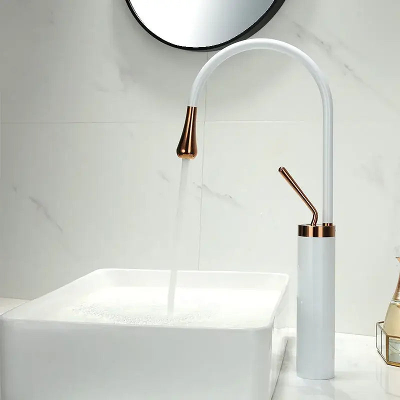 White ceramic sink with decorbites black gold basin faucet featuring sleek curved rose gold accents and swivel handles