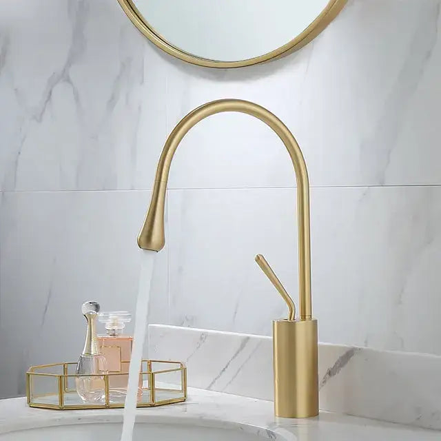 Gold-toned decorbites black gold basin faucet with sleek arched design and brushed metal finish for kitchen sink use