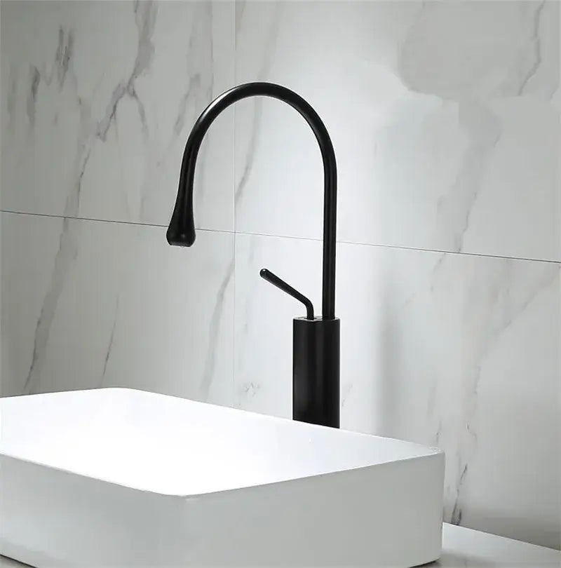 Decorbites black gold basin faucet with black matte finish curved spout and cylindrical base for kitchen sink use