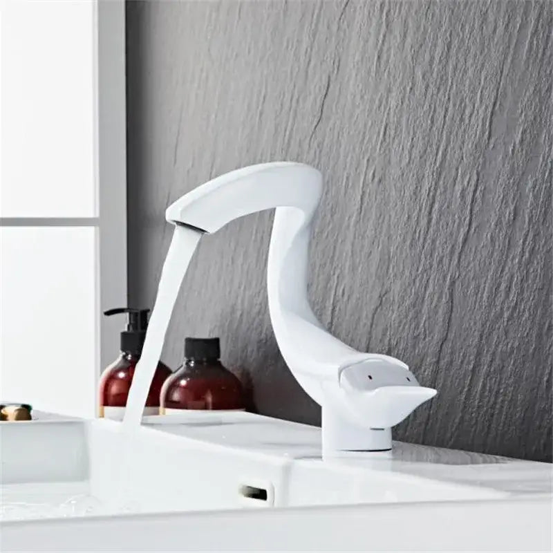 White ceramic swan-shaped decorbites black gold brass bathroom faucet with sleek curved design and smooth finish