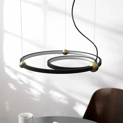 Modern black gold chandelier featuring sleek metal led rings in a minimalist decorbites black gold design