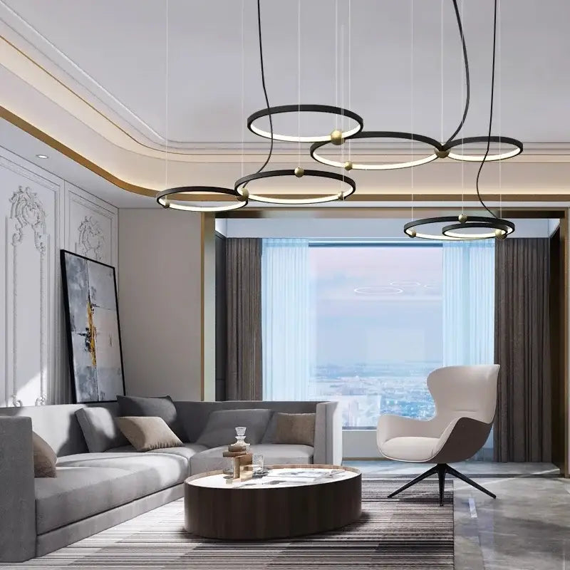 Modern black gold chandelier by decorbites featuring circular metal led rings with gold accents for elegant lighting