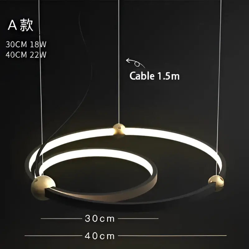 Modern minimalist decorbites black gold chandelier with two concentric led rings and polished brass connectors suspended by cables