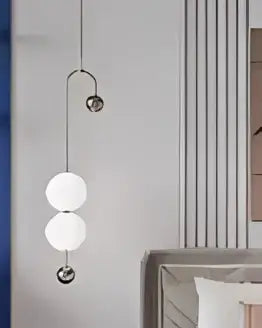 Decorbites black gold chandelier pendant with three spherical glass bulbs suspended by thin metallic chains