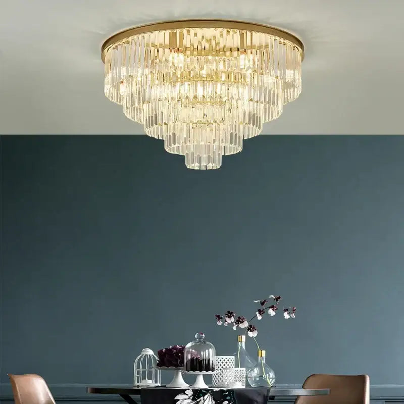Decorbites black gold crystal ceiling chandelier with multi-tiered clear glass prisms and a gold crystal frame for luxe spaces
