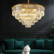 A decorbites black gold crystal ceiling chandelier with gold crystal frame and clear glass rods above emerald sofa